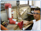 Desktop arm for particles suction from industrial polishing and finishing processes